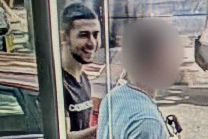 Man sought over assault on parking inspector