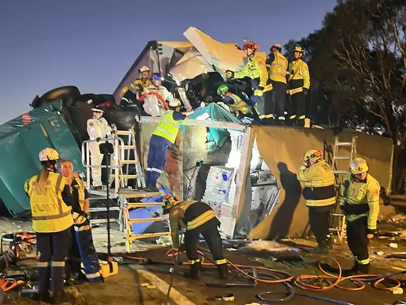 One dead, another trapped in truck crash carnage