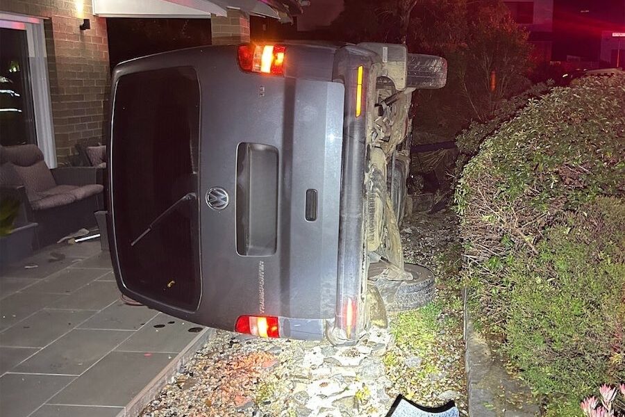 Drunk van driver misses corner and hits house