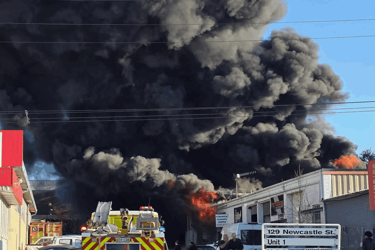 Fyshwick exhaust shop fire sets sky black