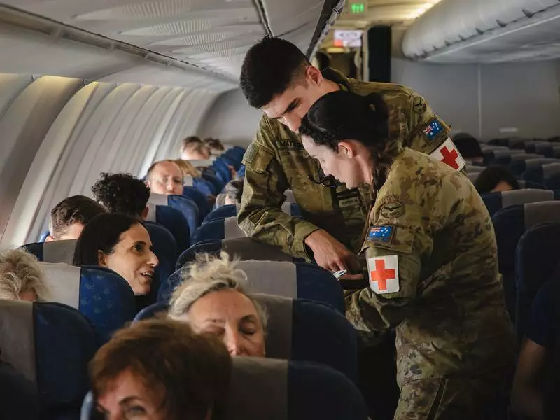 ‘Torn’ Aussies flee conflict as many more left waiting