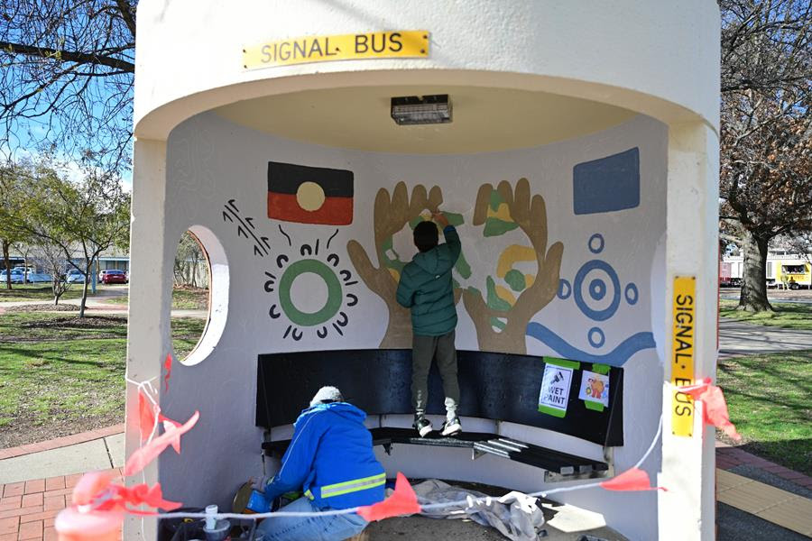 Young artist paints reconciliation on to bus stop