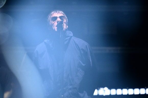 Oasis frontman unleashes after flares thrown into crowd